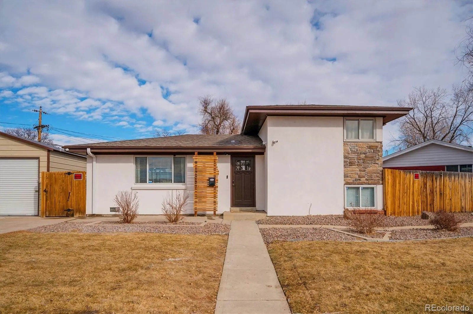 Stucco and stone ranch at 12227 East Park Lane Drive