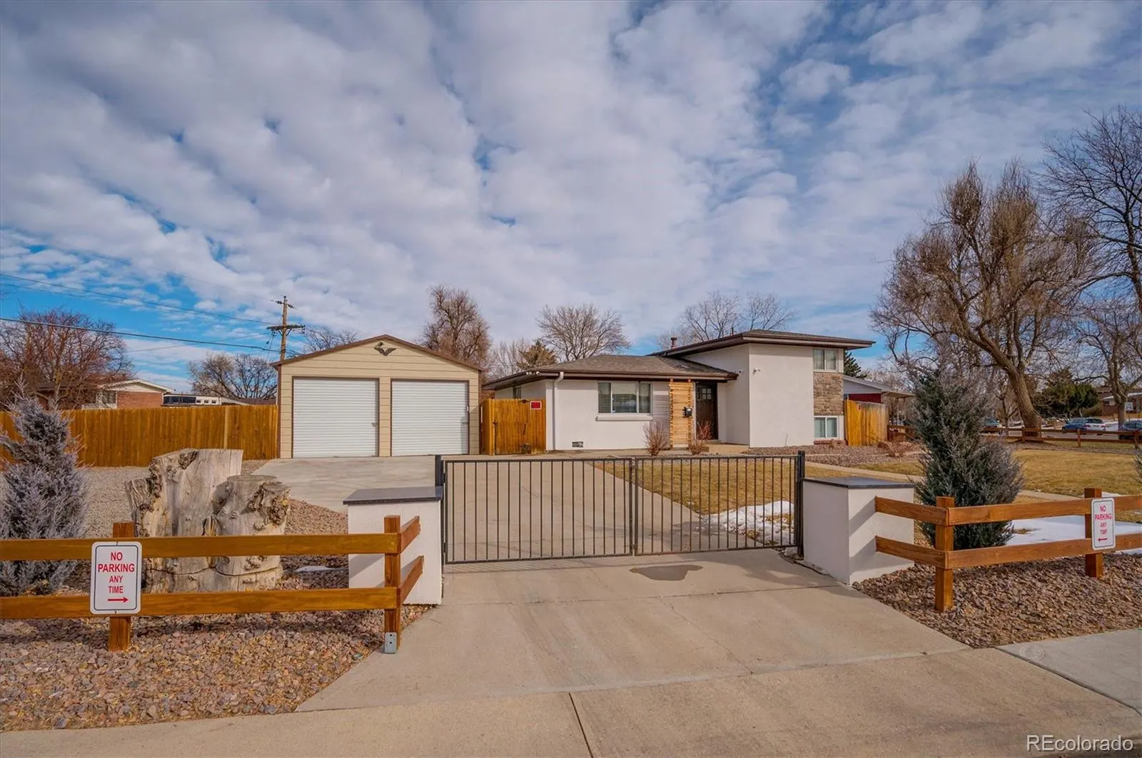 Front gate, driveway and detached garage