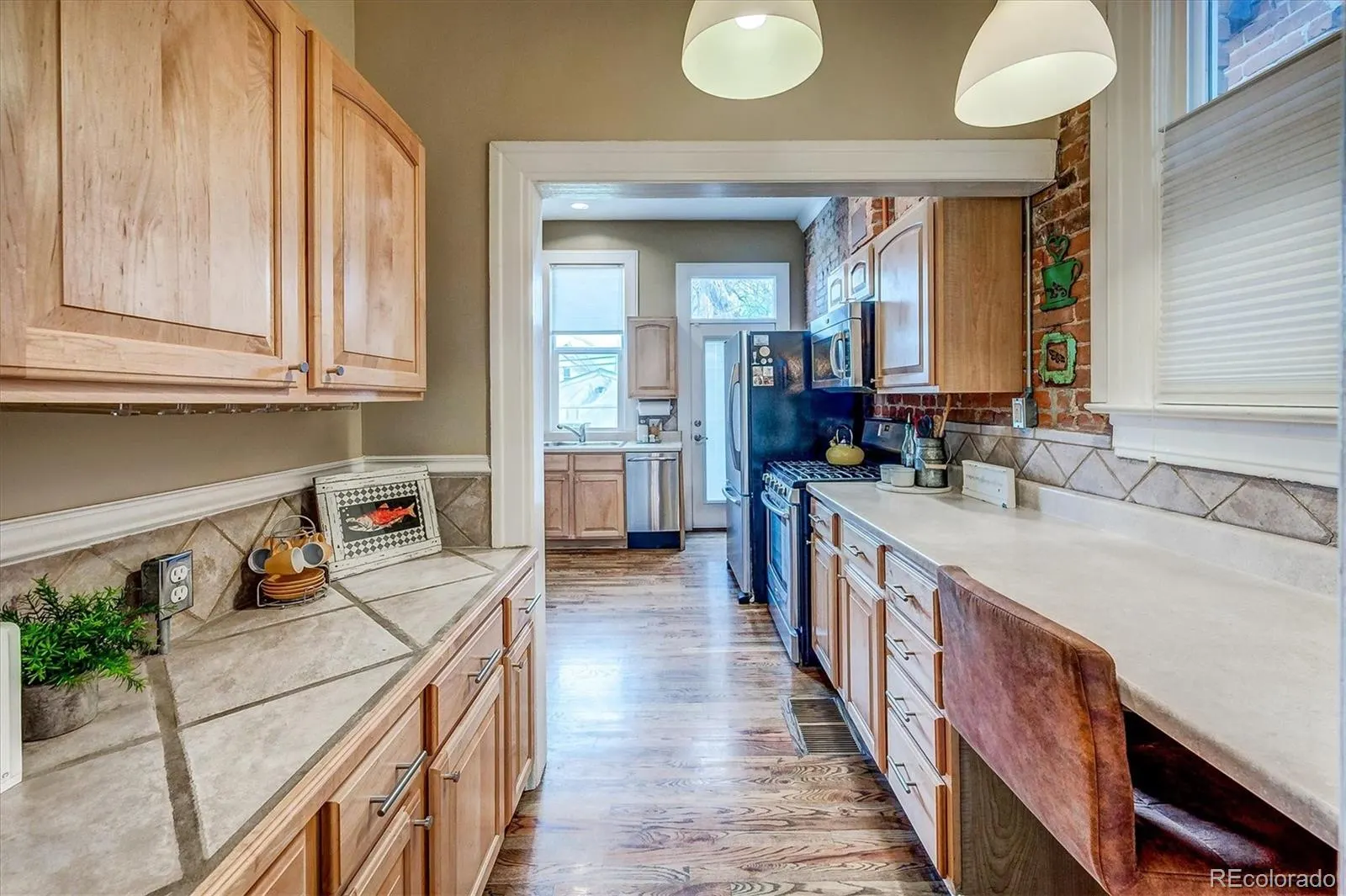Kitchen with gas range and breakfast area