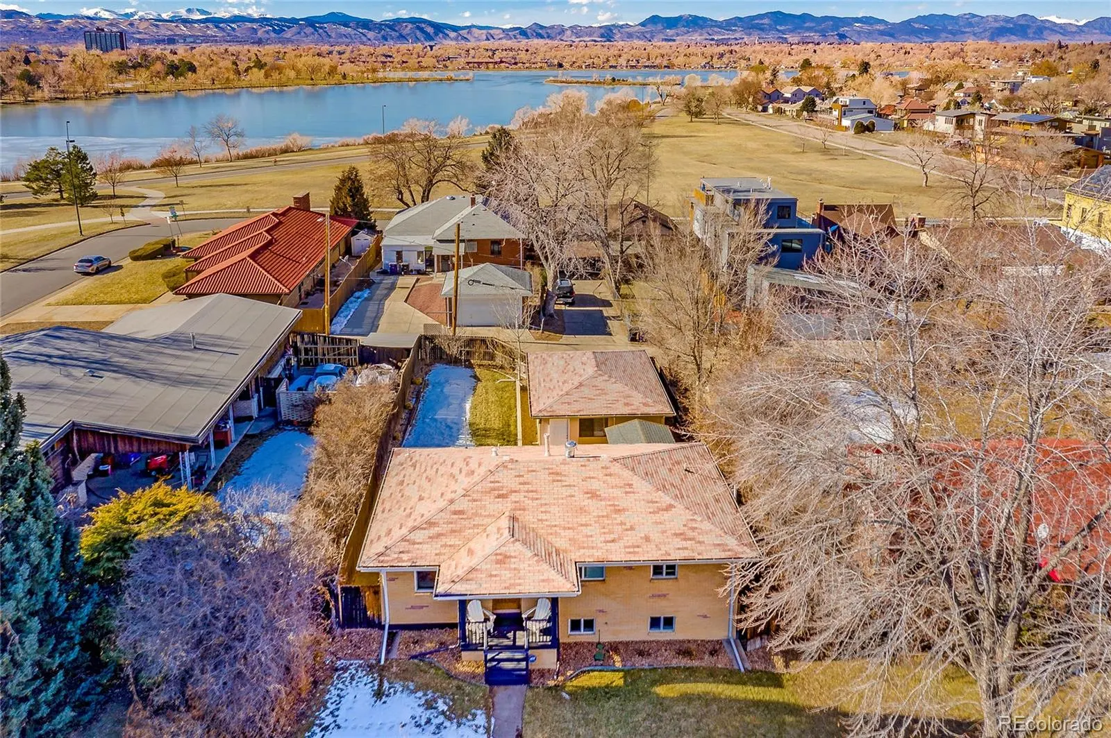 Aerial view of 1915 Meade Street with Sloan’s Lake and the mountains beyond