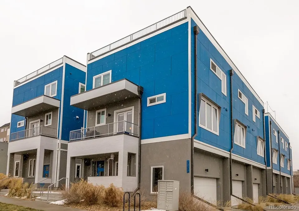 Blue and gray modern townhomes at 2326 Clay Street