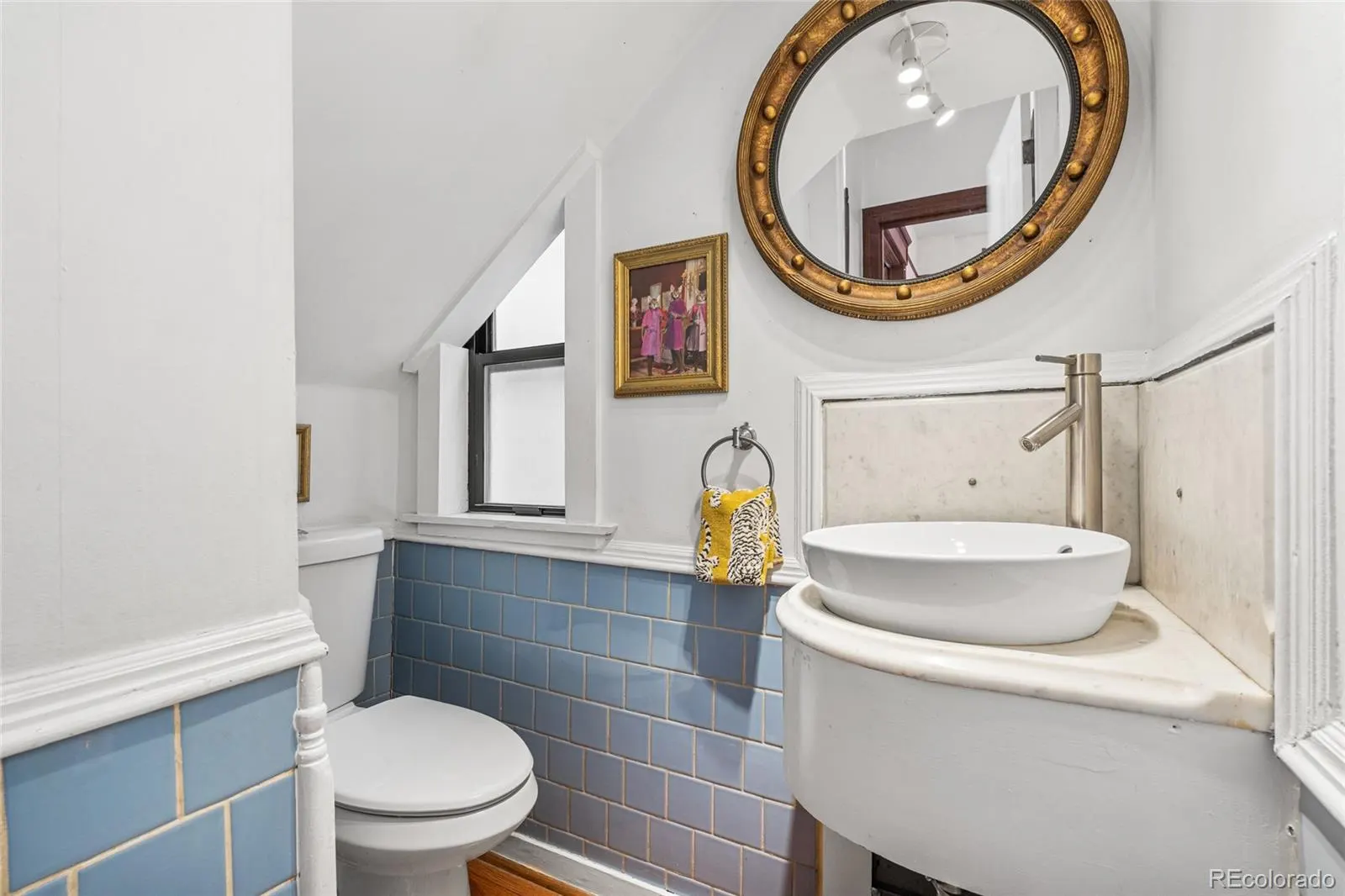 Bath with blue tile and vintage fixtures