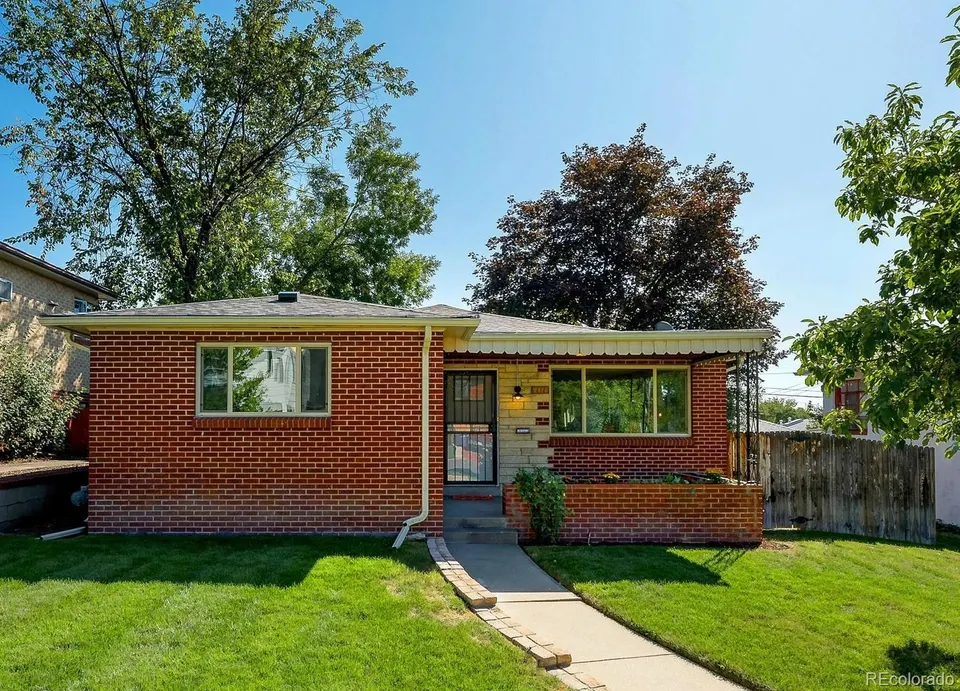 Mid-century brick home at 2476 Zenobia Street with front lawn