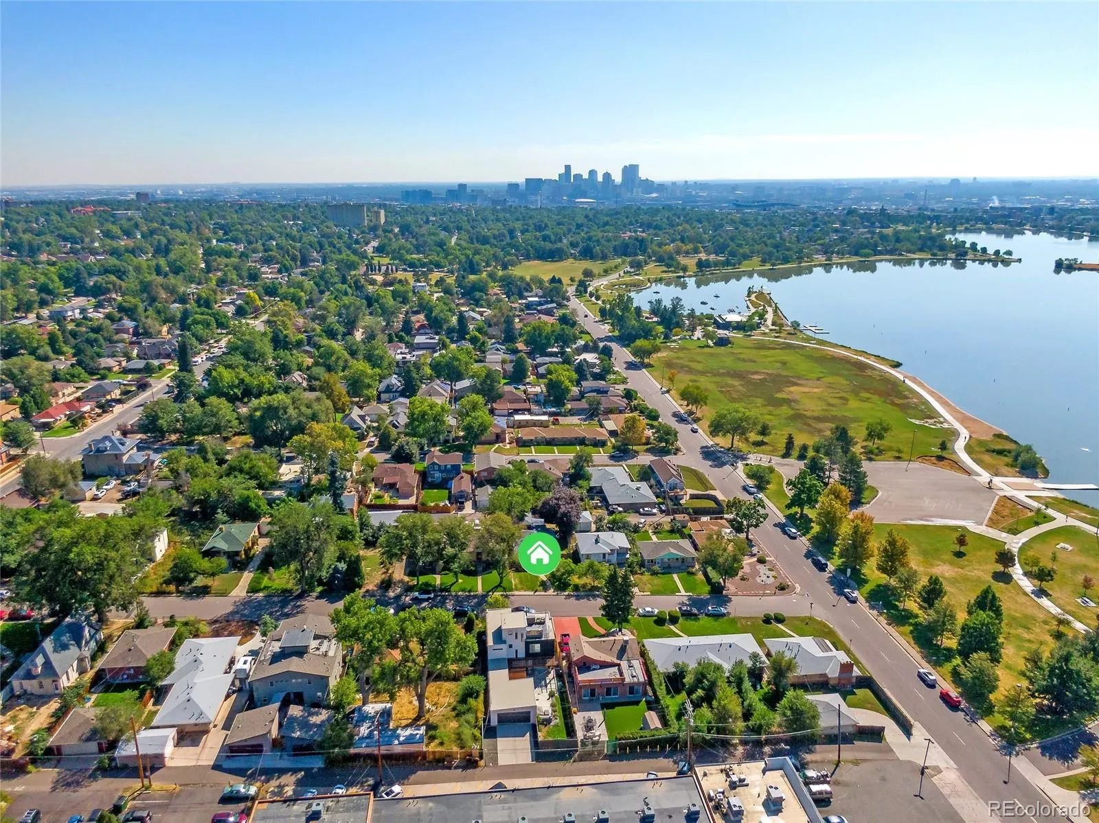 Sloan’s Lake & West Highland — Aerial view over Sloan’s Lake toward the downtown Denver skyline