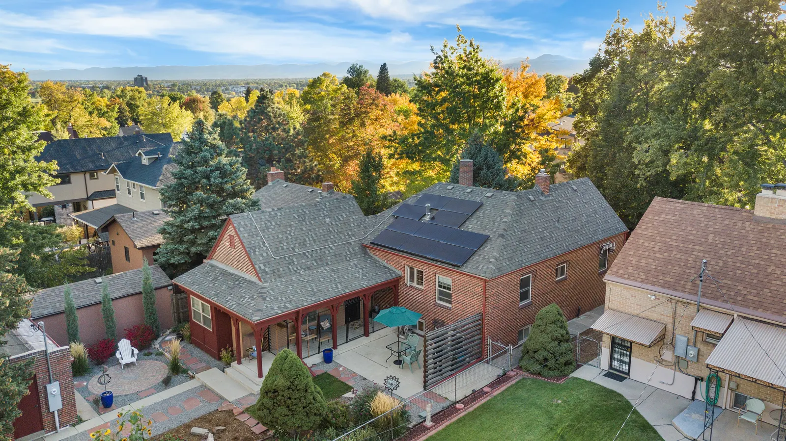 Aerial view of the Tudor showing solar panels, rear porch and backyard