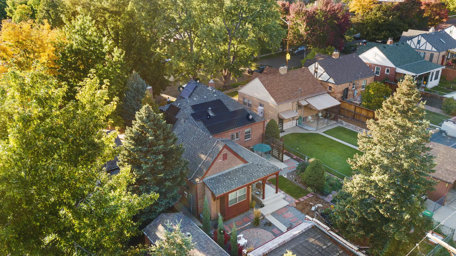 Aerial of the home and its tree-lined block