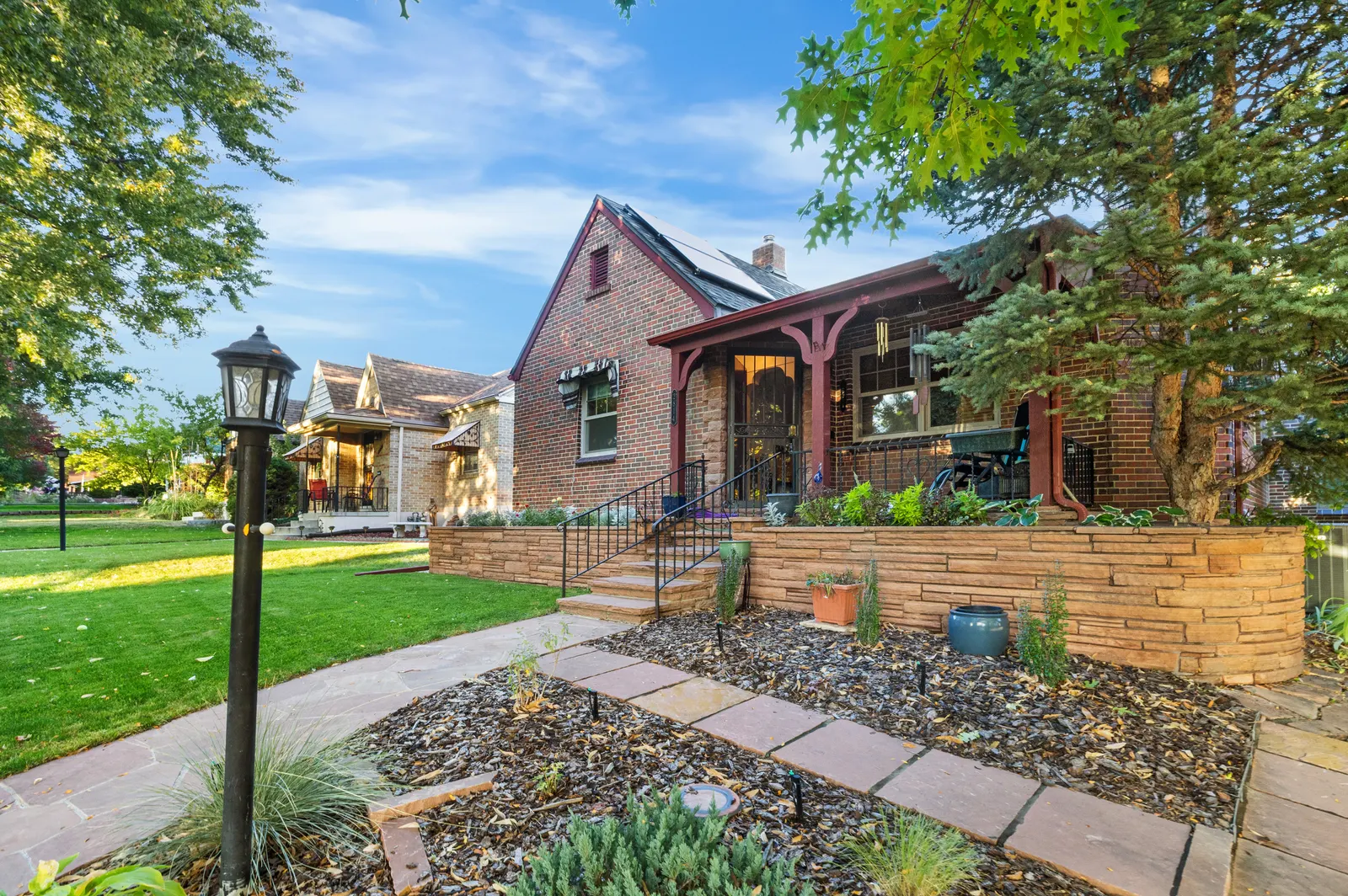 Flagstone front walk, lamp post and covered porch of the Tudor on Stuart Street