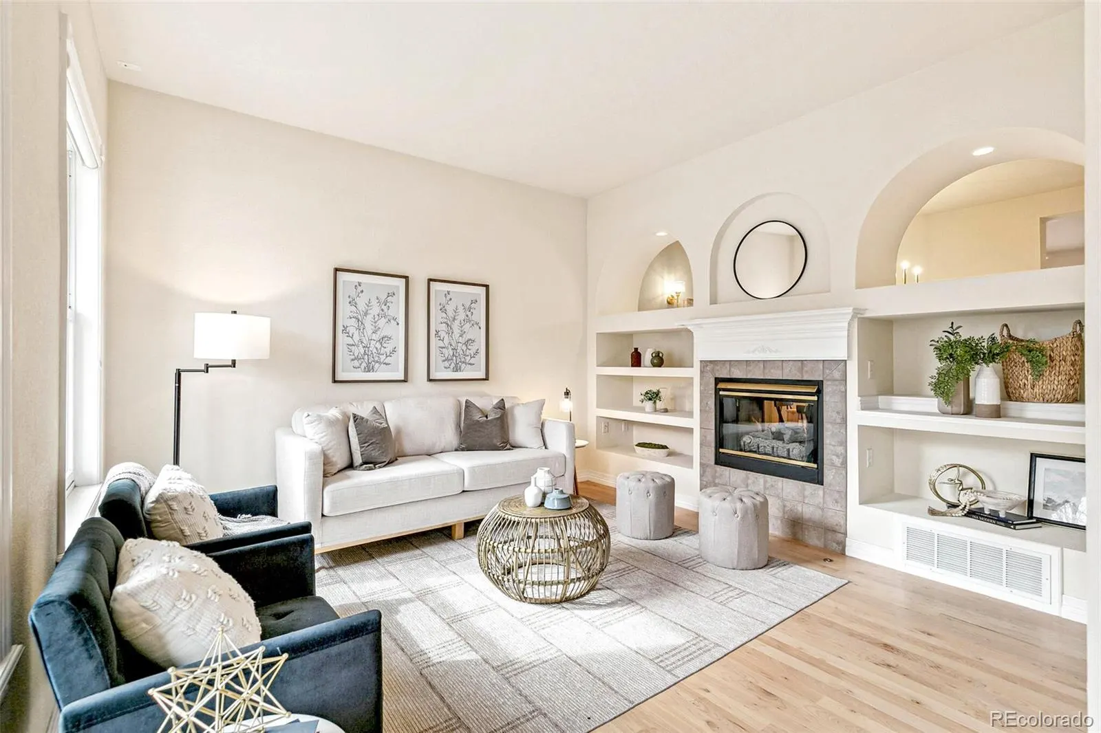 Living room with built-in shelving flanking the fireplace
