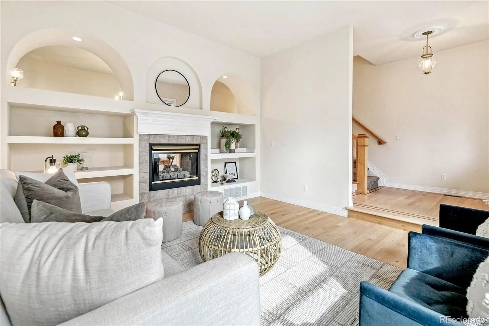 Double-sided fireplace and arched built-ins