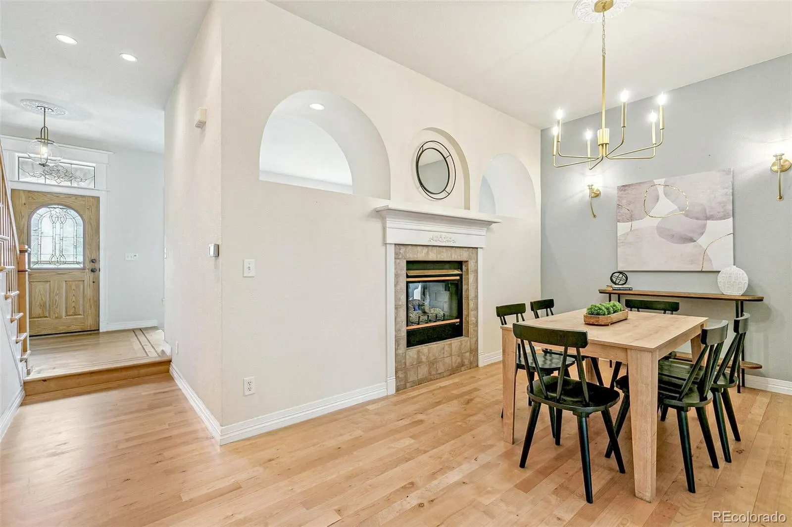 High-ceilinged dining room open to the foyer