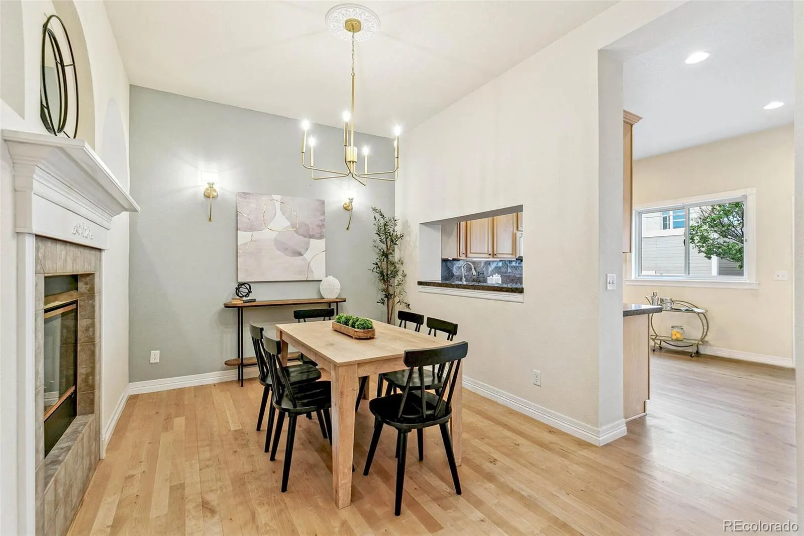 Dining room beside the fireplace and chandelier