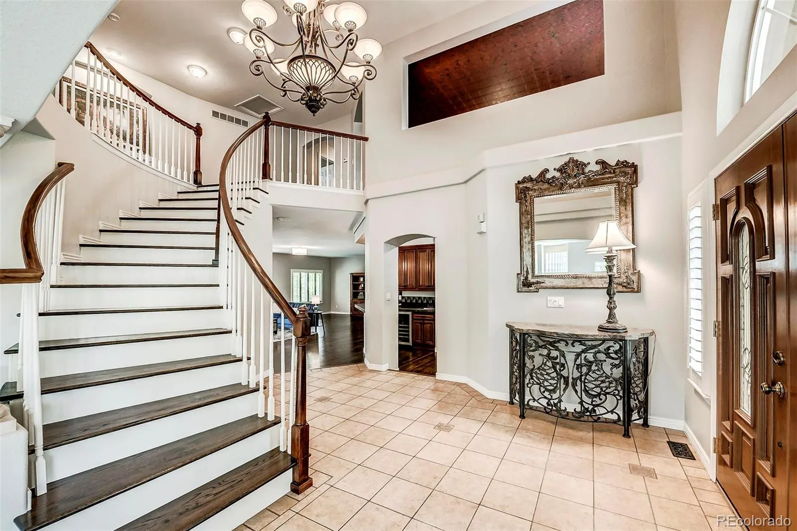 Two-story foyer with curved staircase