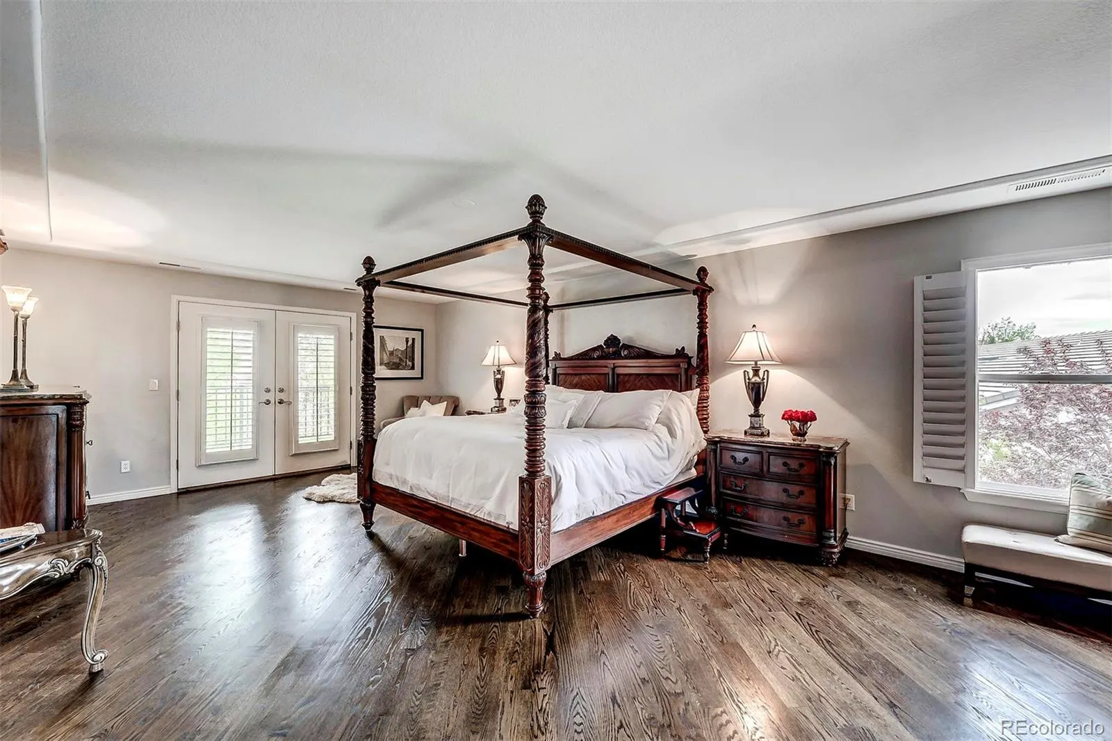 Primary bedroom with four-poster bed