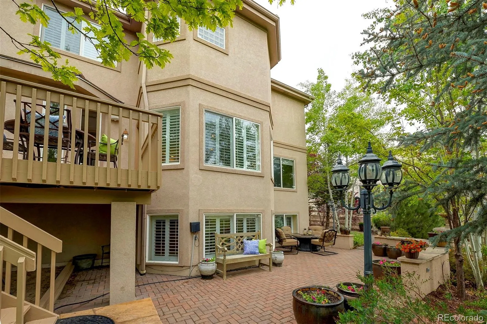 Rear of the home with deck and patio