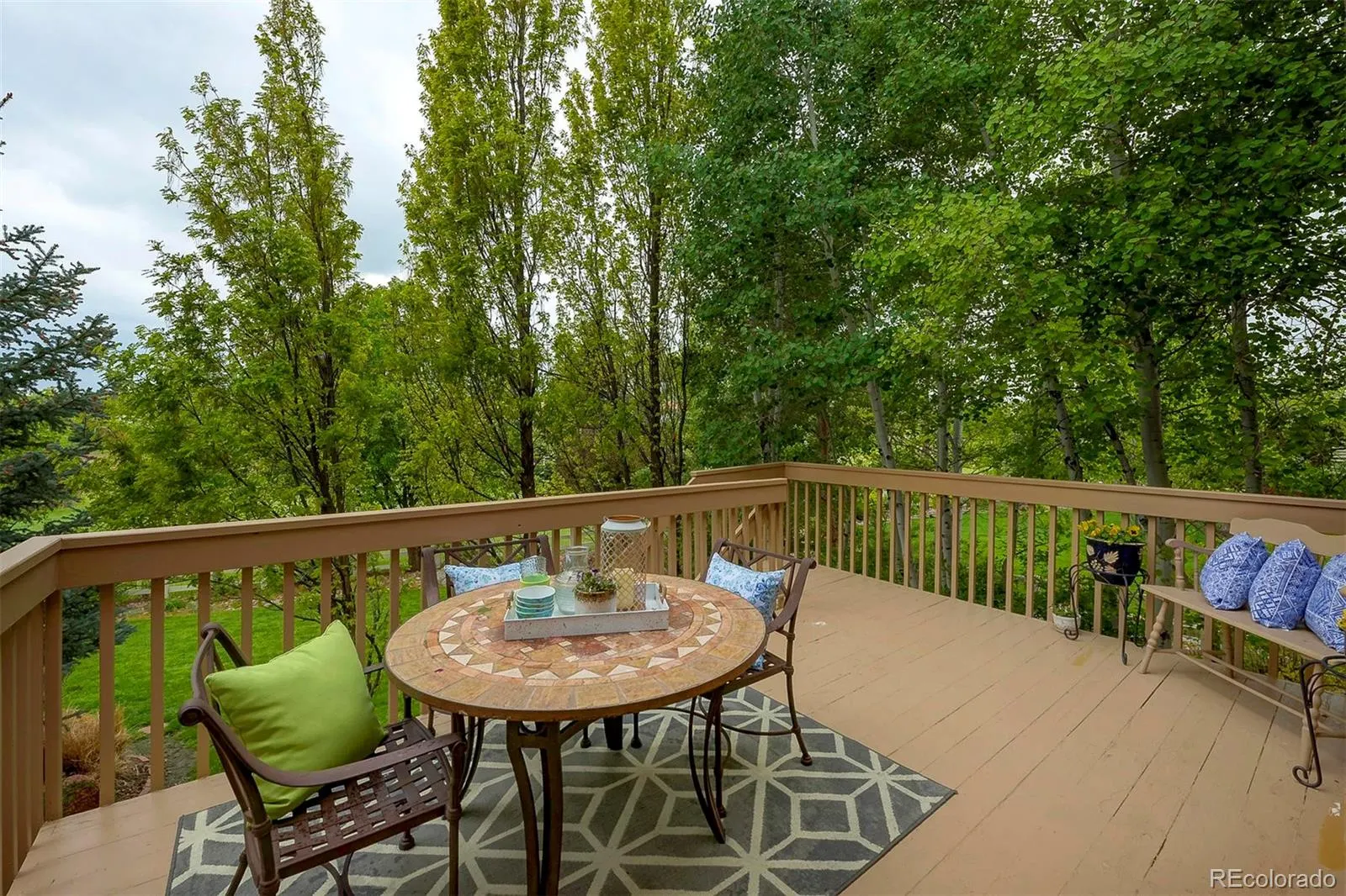 Deck seating overlooking the trees