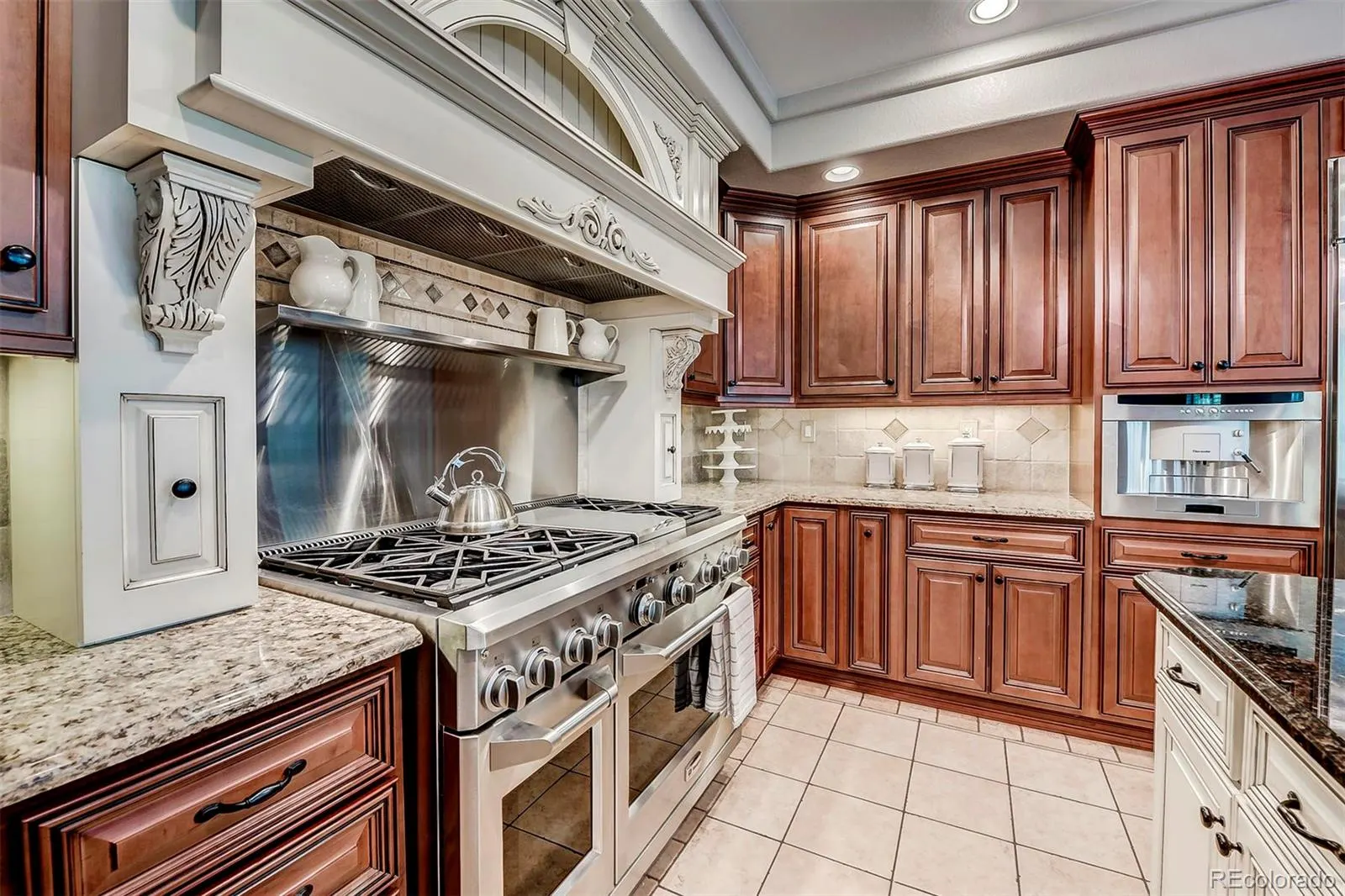 Custom kitchen with cherry cabinets and professional range