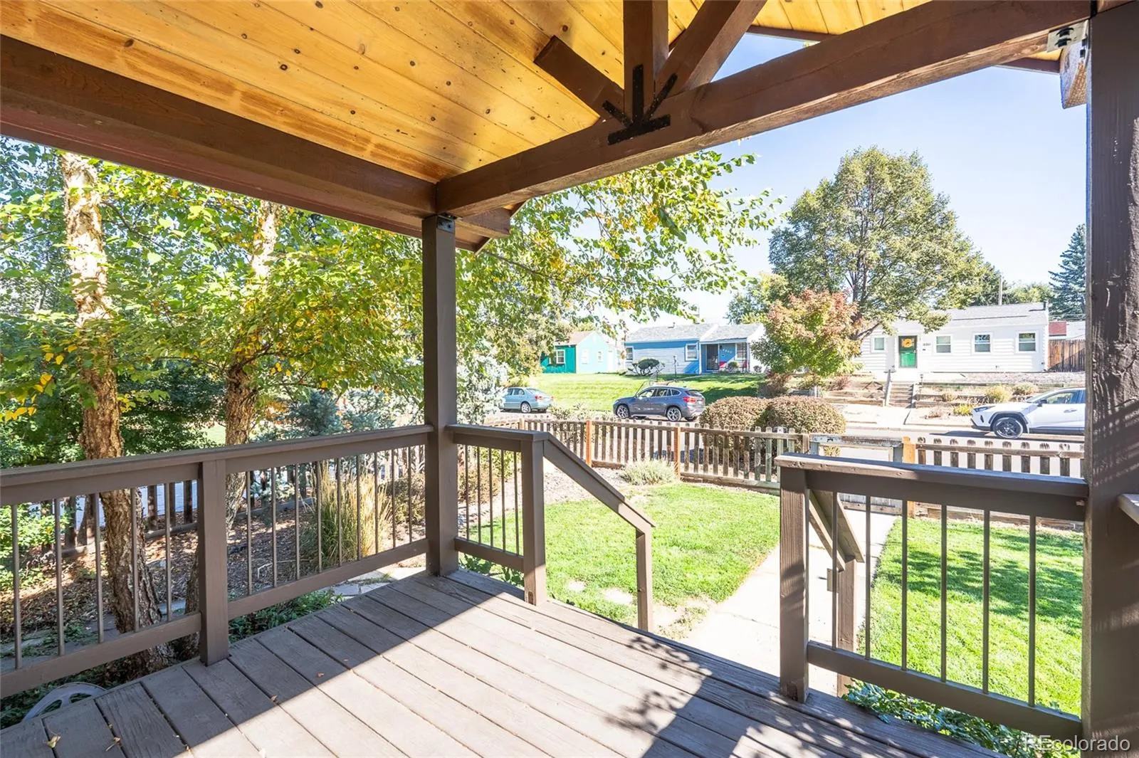 Covered rear deck overlooking the backyard