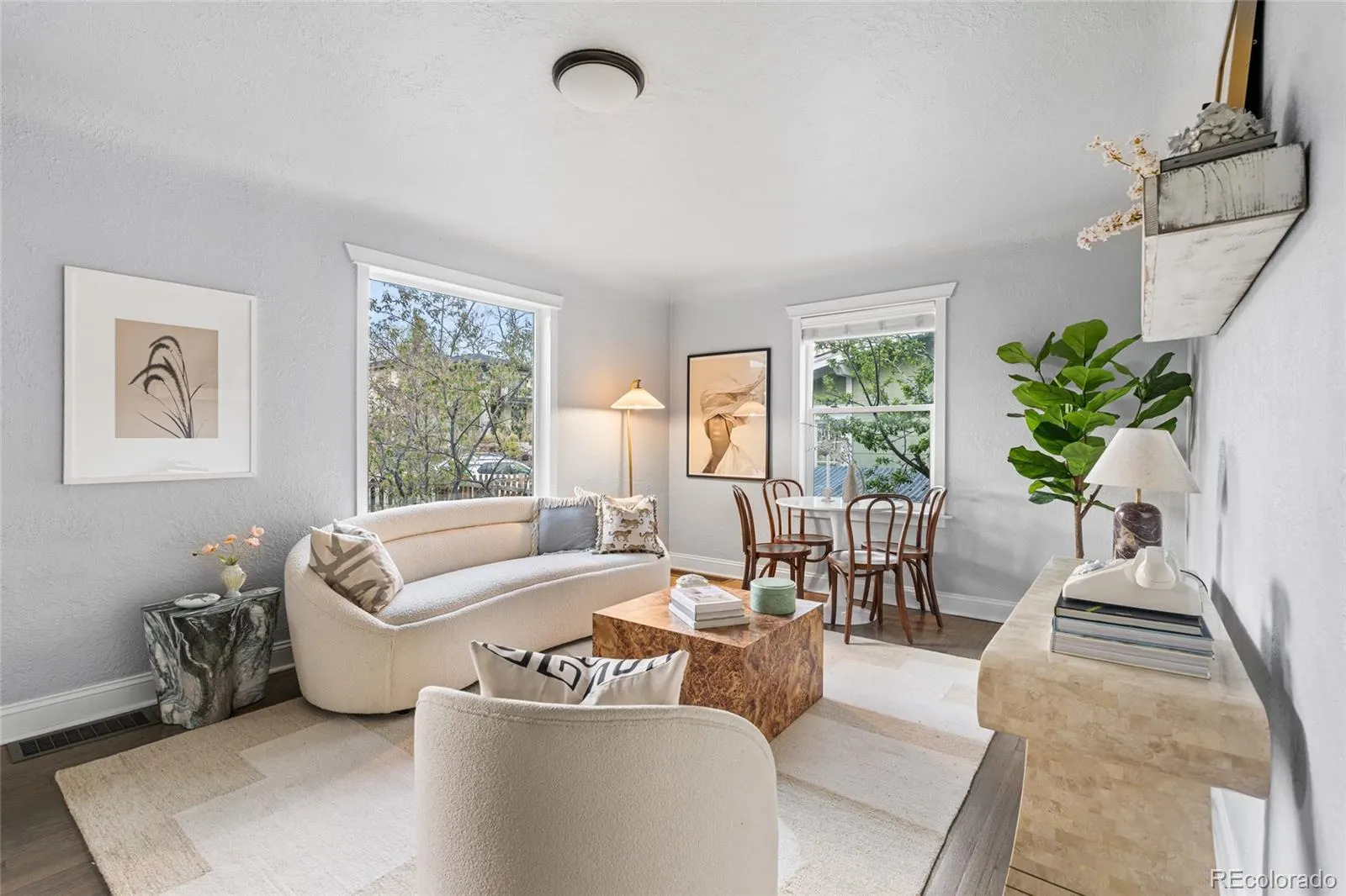 Living room with oak floors and corner windows