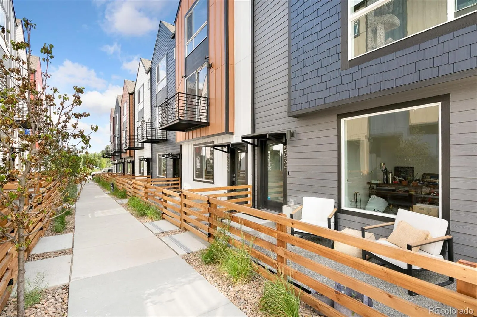Lakewood — Row of modern townhomes with cedar fences at West Line Village, Lakewood