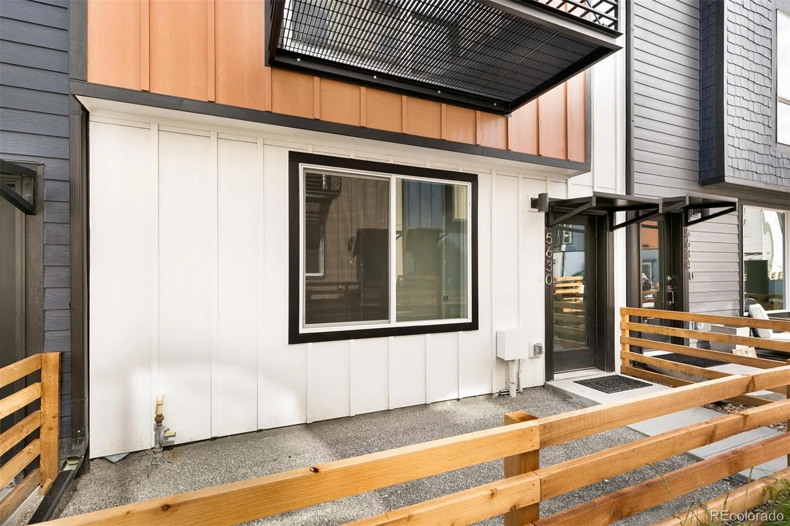 Front entry with wood fence