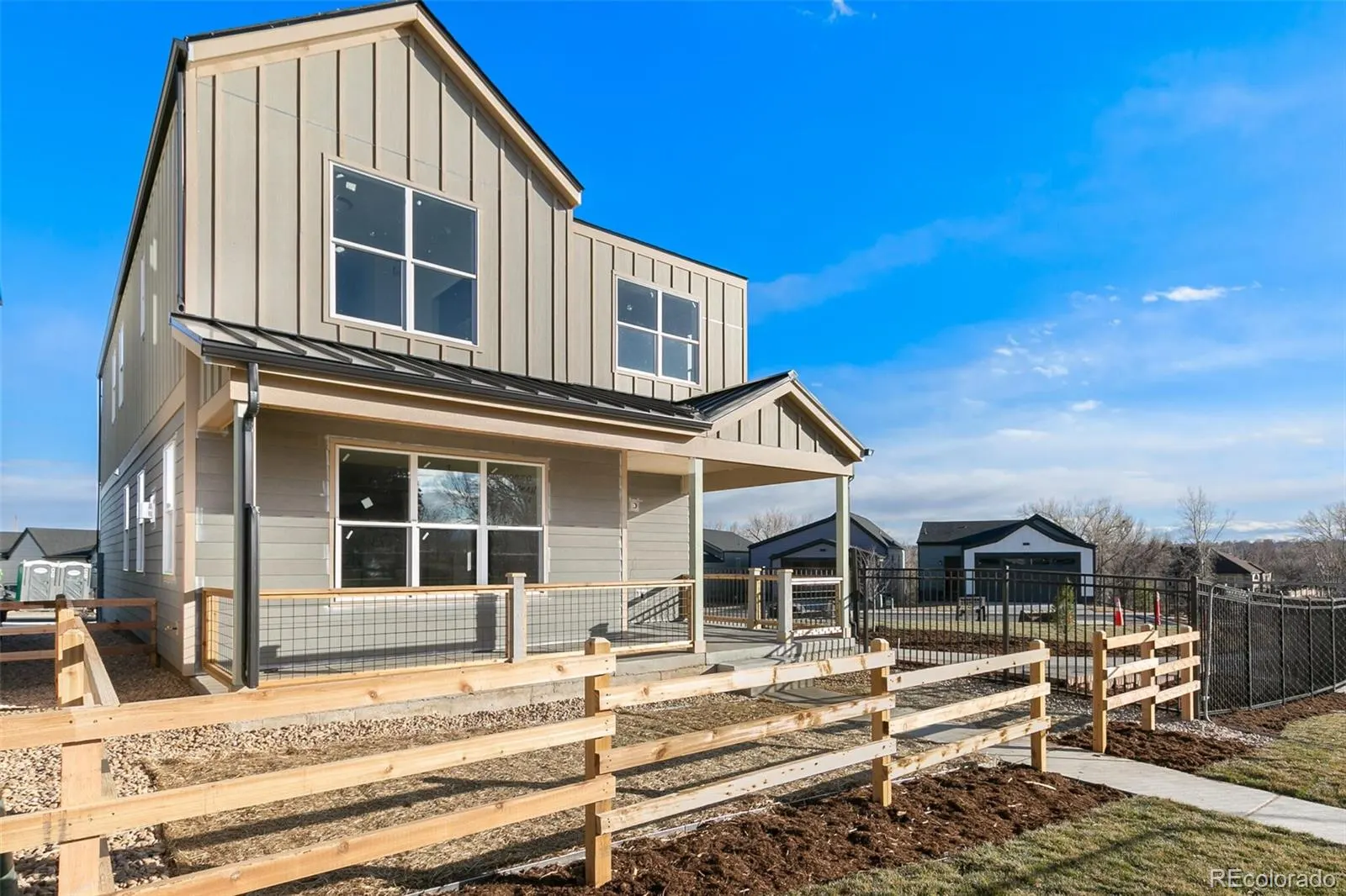 Front of the two-story home at Berkley Shores under a blue sky