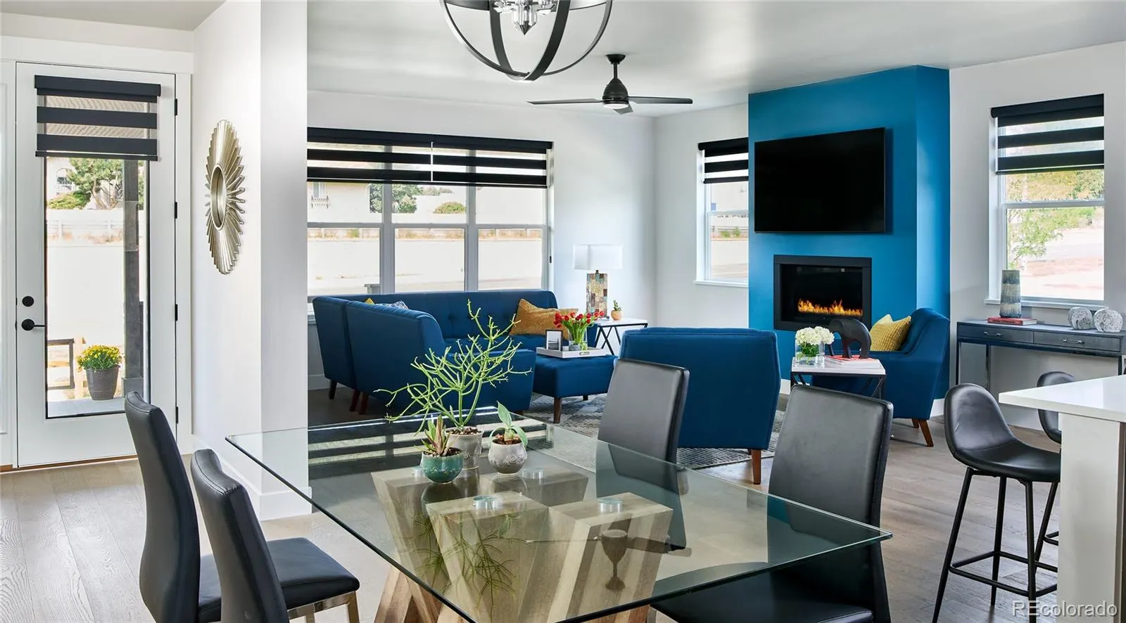 Living room with fireplace and blue accent wall