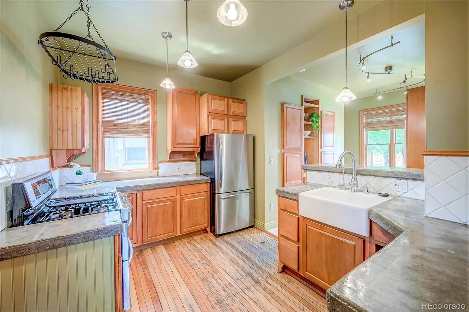 Kitchen with farmhouse sink and marble floor