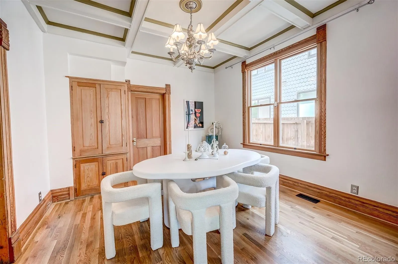 Dining room with chandelier and original woodwork