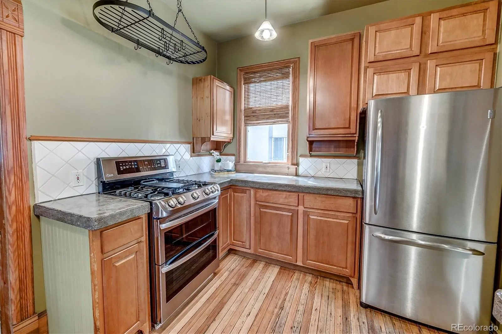 Kitchen with concrete counters and open shelving